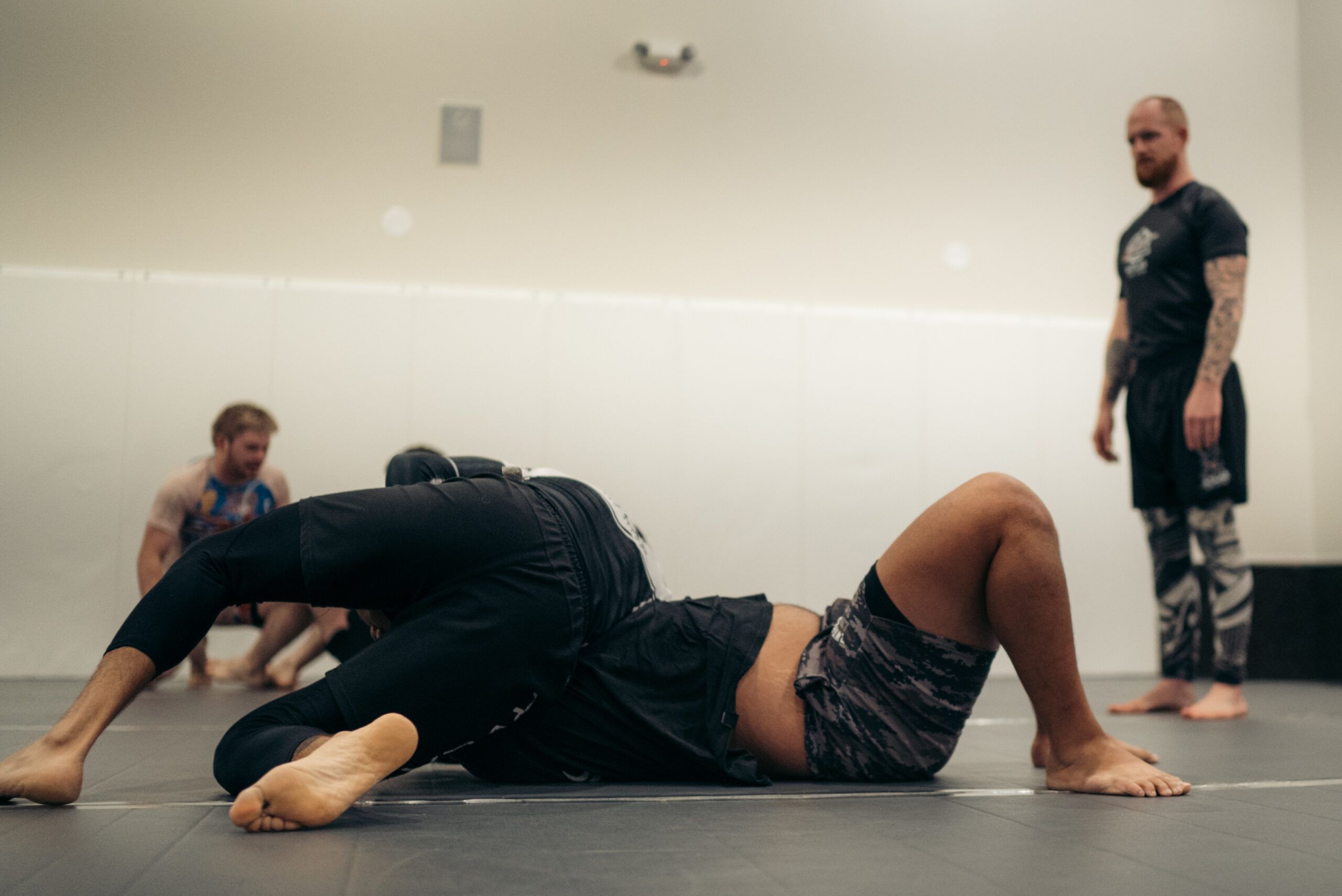 Two Atlas students drilling a no-gi guard position